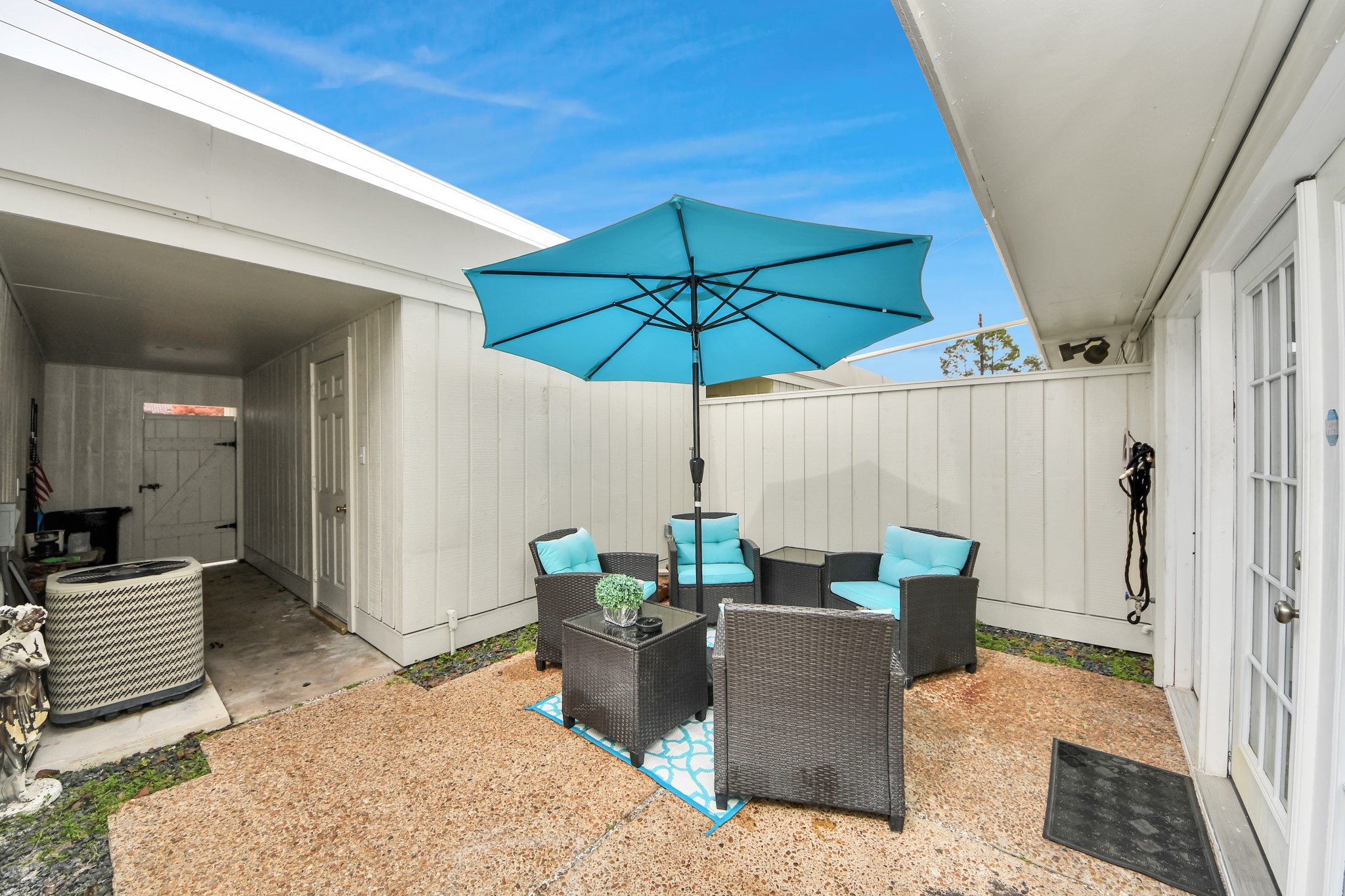 12757 Huntingwick Drive, Unit 142 Houston, TX 77024 - Photo 32 of 36 Cozy patio providing a comfortable outdoor area for leisure, reading, or casual entertaining.