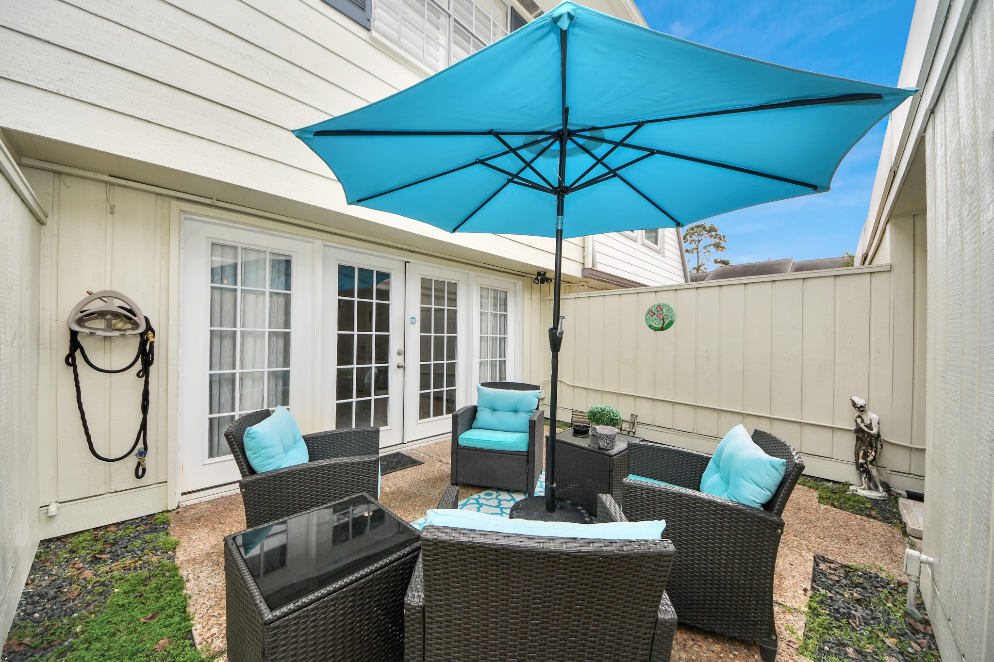 12757 Huntingwick Drive, Unit 142 Houston, TX 77024 - Photo 34 of 36 Inviting patio ideal for relaxing afternoons or hosting small gatherings with guests
