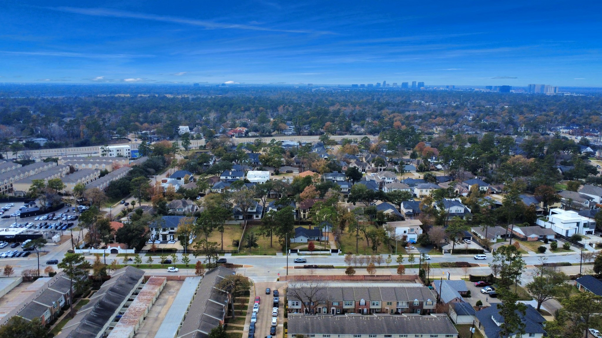 12757 Huntingwick Drive, Unit 142 Houston, TX 77024 - Photo 6 of 36 Overhead view highlighting the organized community setting and nearby residential surroundings.
