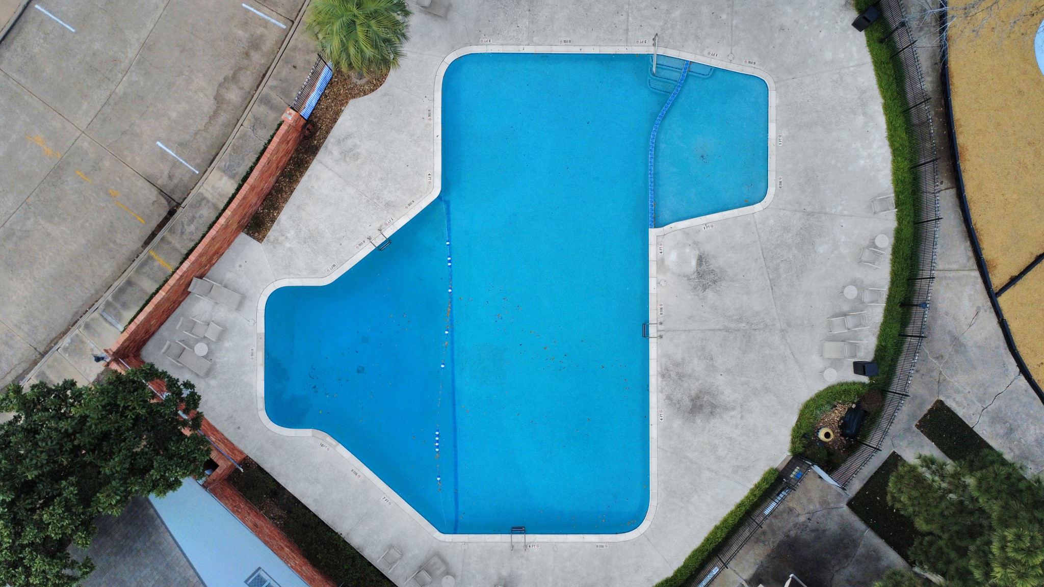 12757 Huntingwick Drive, Unit 142 Houston, TX 77024 - Photo 8 of 36 Overhead view showcasing the community pool as part of this peaceful condo community.