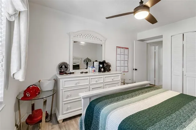 a bedroom with a bed and cabinets