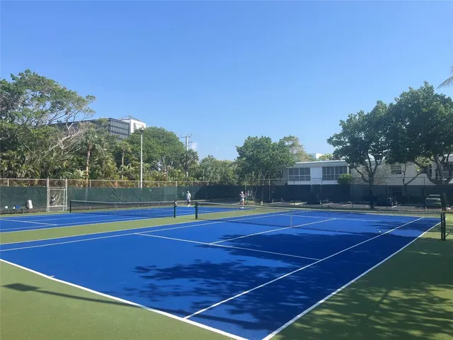 a view of an outdoor space and tennis court