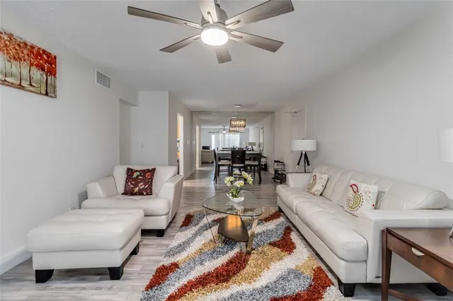 a living room with furniture and a rug