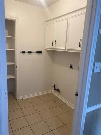 a view of a closet with wooden floor