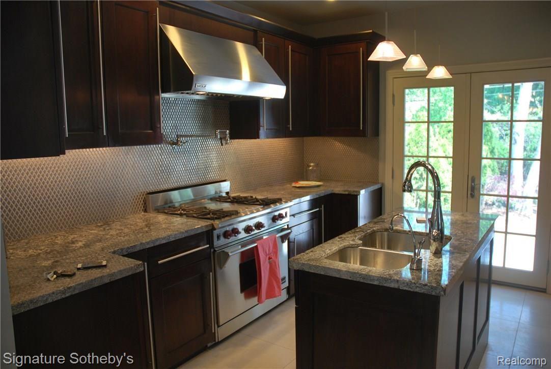 83 Amherst Road Pleasant Ridge, MI 48069 - Photo 6 of 15 New Kitchen with Stainless Steel Appliances. Like a Wolf Oven/Range (view from great room)