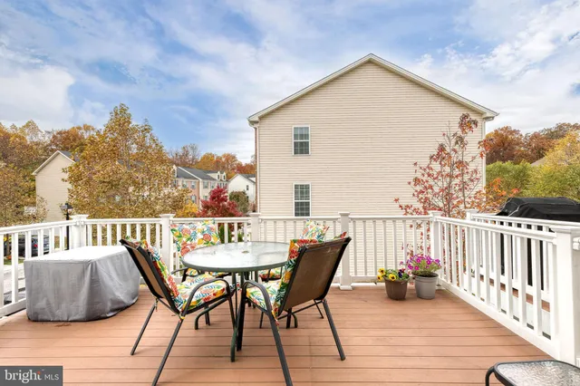 a view of a chairs and table on the deck
