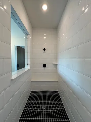 a bathroom with a sink and a shower