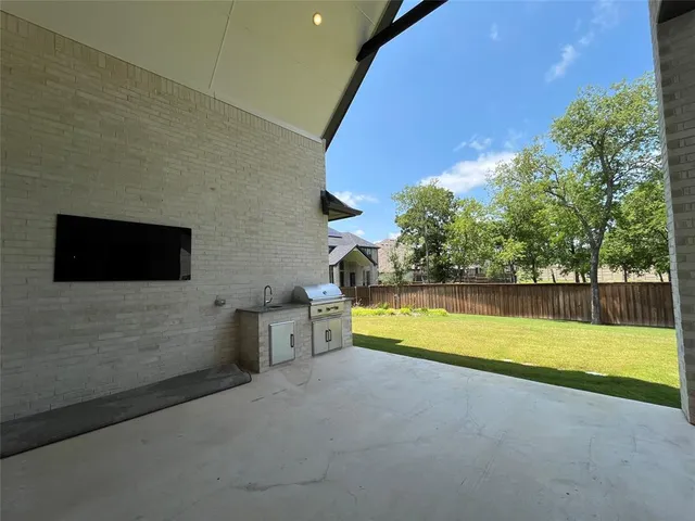 a view of a house with swimming pool and sitting area