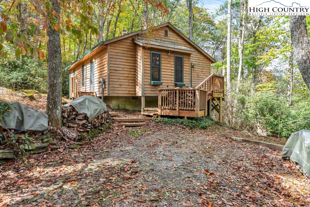 180 Wild Blackberry Hill Road Boone, NC 28607 - Photo 19 of 30 a view of a house with a yard and sitting area