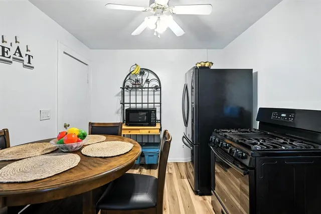 a kitchen with stainless steel appliances granite countertop a stove and refrigerator
