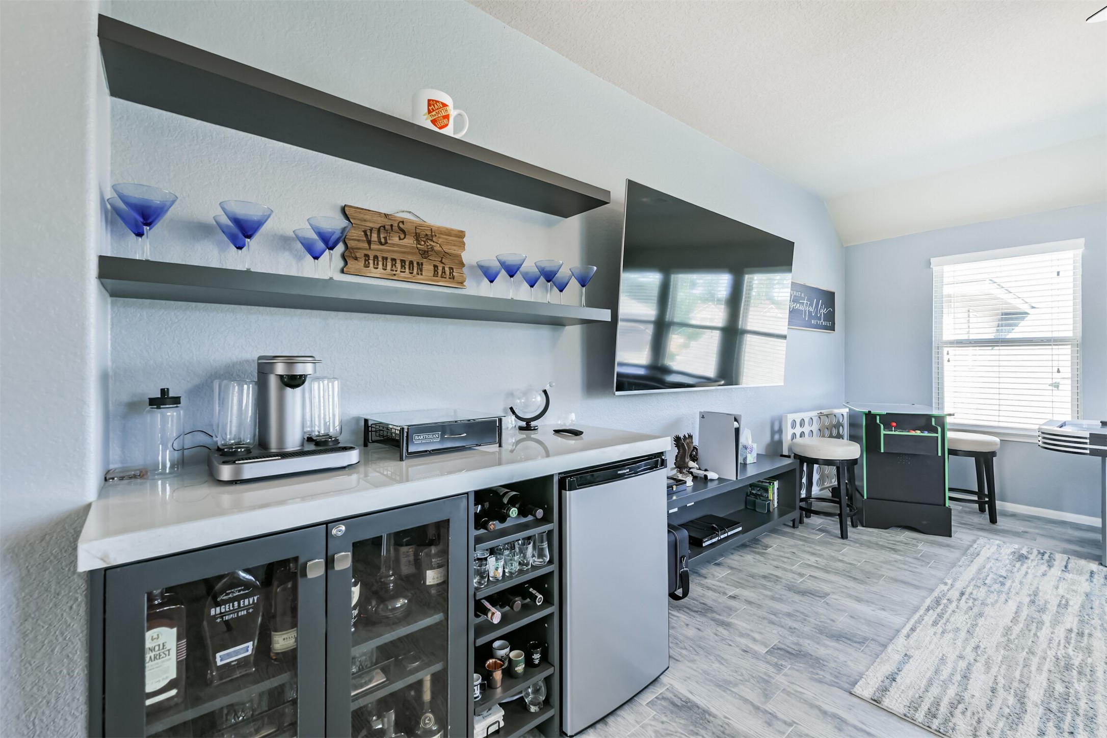 24047 Schults Meadow Lane Spring, TX 77389 - Photo 32 of 47 a kitchen with stainless steel appliances a sink a stove and wooden floor