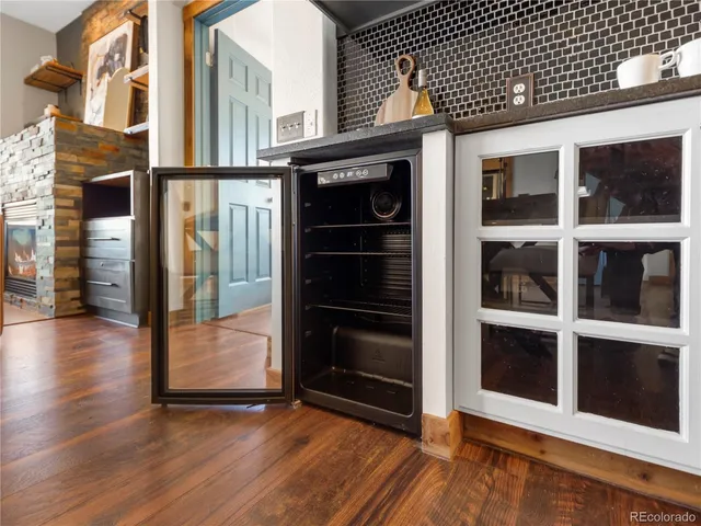 a kitchen with sink and refrigerator
