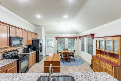 a living room with fireplace furniture and a flat screen tv