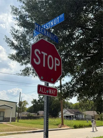 a street sign on a pole on a street