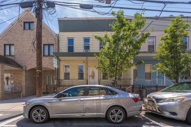 a view of a car parked in front of a house