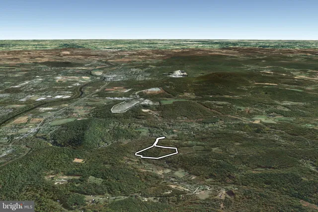 a view of a water with an ocean beach