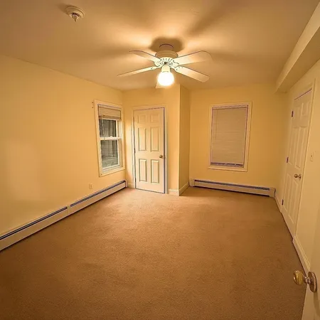 a view of an empty room with a window