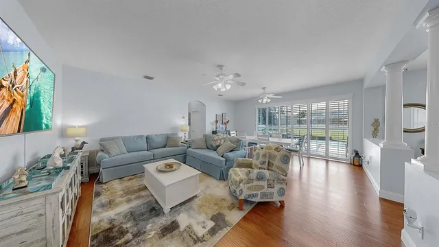 a view of a dining room with furniture window and wooden floor