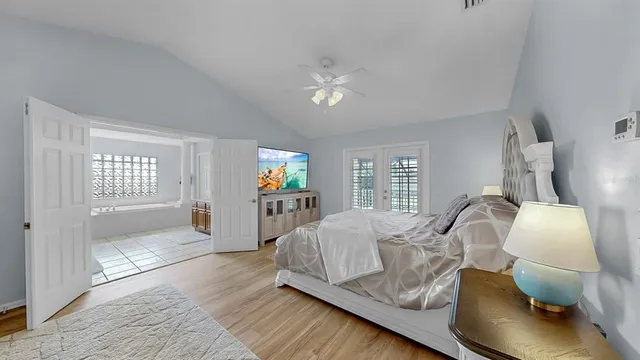 a large bathroom with a tub a sink and mirrors