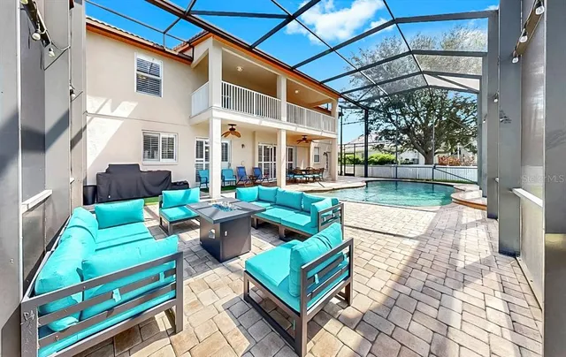 a view of a house with a backyard