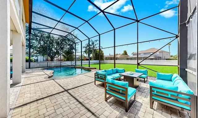 a view of a house with backyard and porch