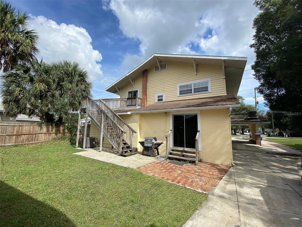 902 South Grove Street, Unit 2 Eustis, FL 32726 - Photo 11 of 11 a view of a house with a yard