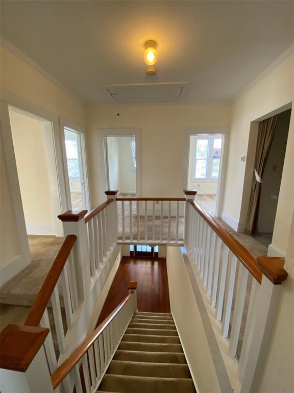 902 South Grove Street, Unit 2 Eustis, FL 32726 - Photo 3 of 11 a view of a hallway with wooden floor and stairs