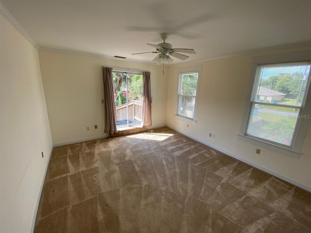 902 South Grove Street, Unit 2 Eustis, FL 32726 - Photo 4 of 11 a view of an empty room with a window