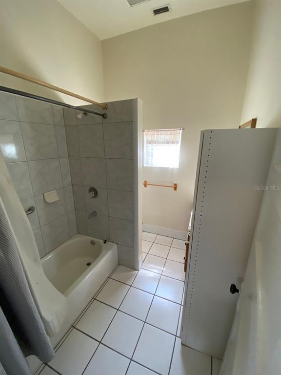 902 South Grove Street, Unit 2 Eustis, FL 32726 - Photo 9 of 11 a bathroom with a bathtub and a shower