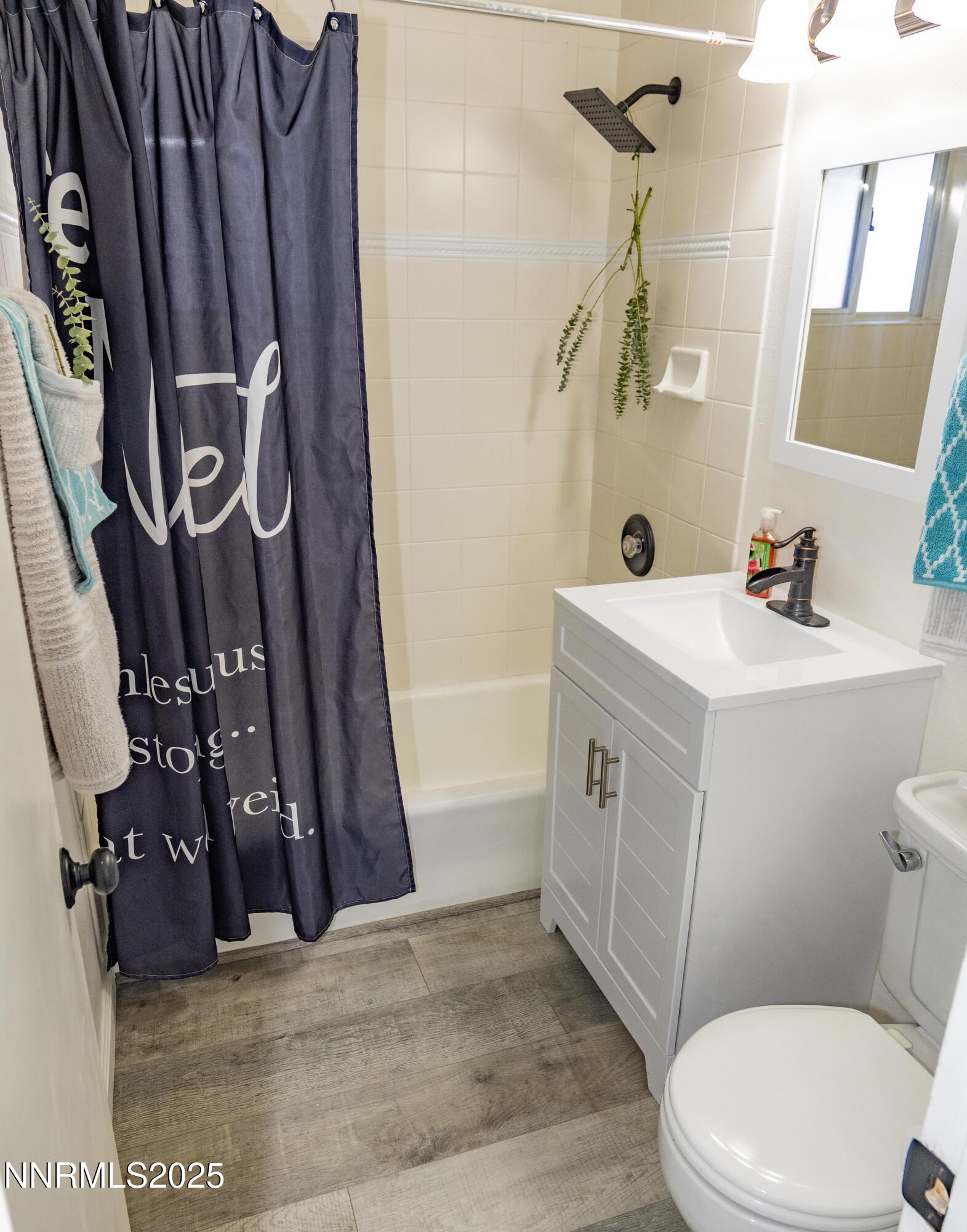 1570 Radcliffe Drive Reno, NV 89502 - Photo 5 of 11 a bathroom with a sink a toilet and shower