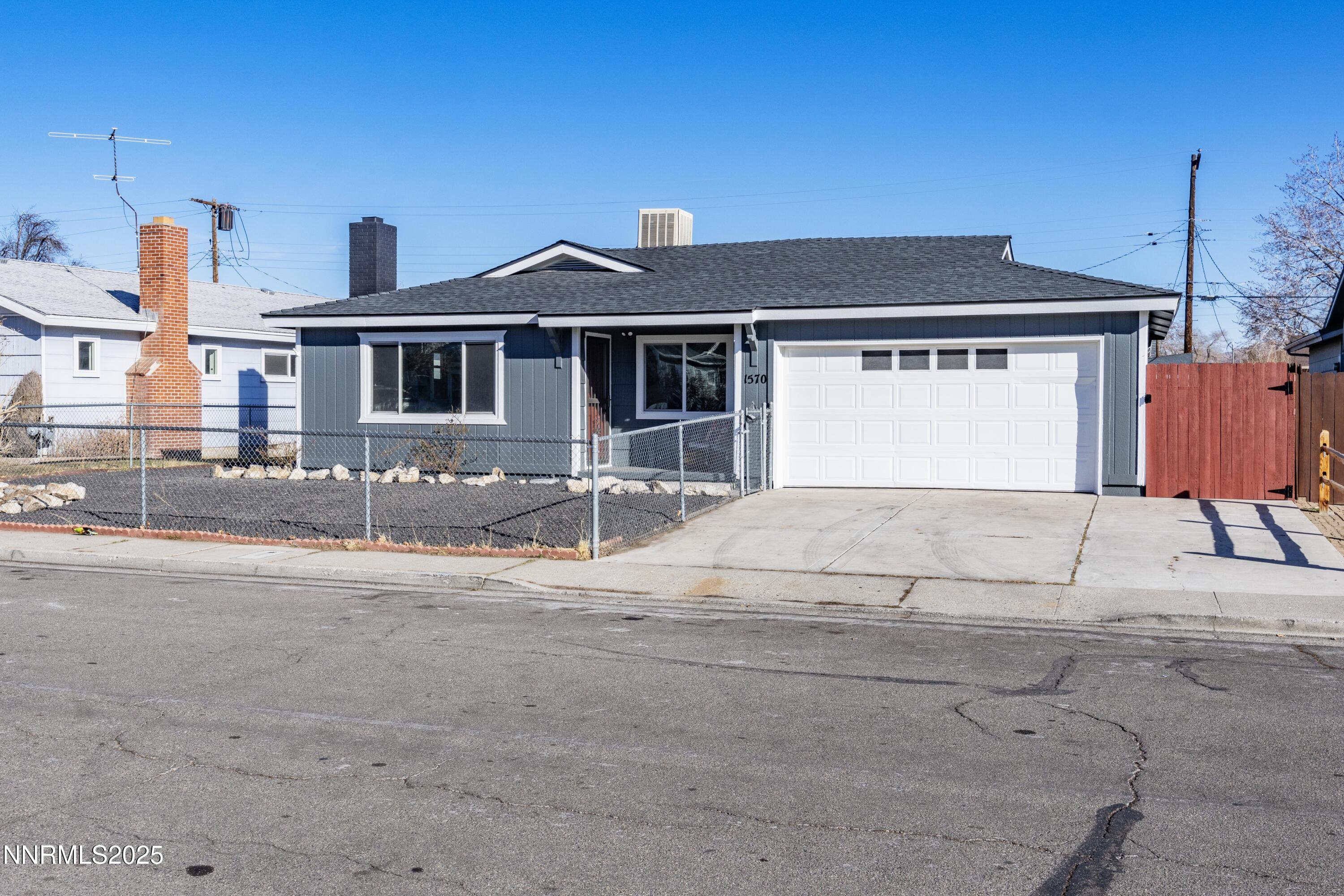 1570 Radcliffe Drive Reno, NV 89502 - Photo 10 of 11 a front view of a house with a yard