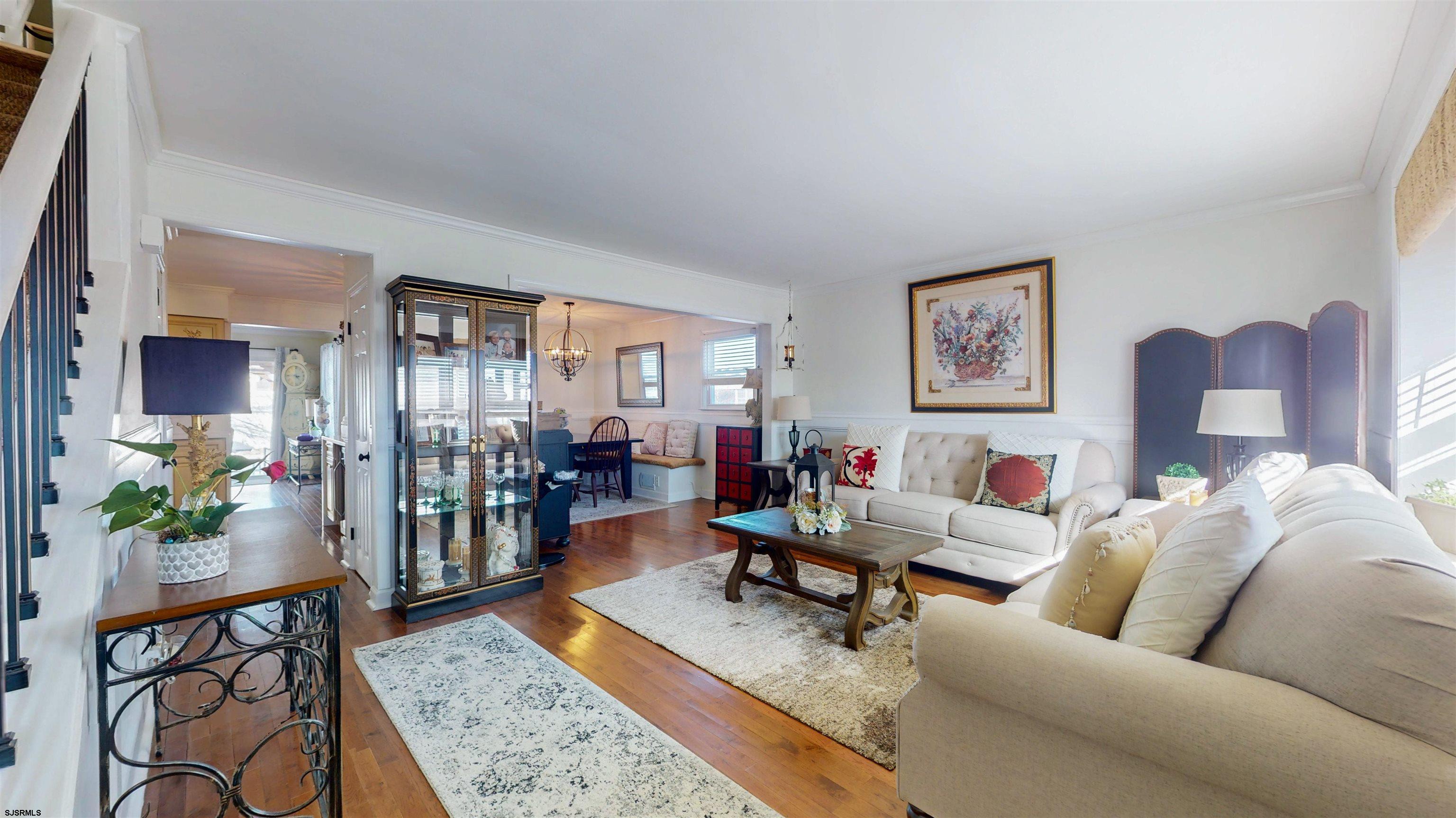 5201 Waterview Drive Brigantine, NJ 08203 - Photo 17 of 33 a living room with furniture and wooden floor