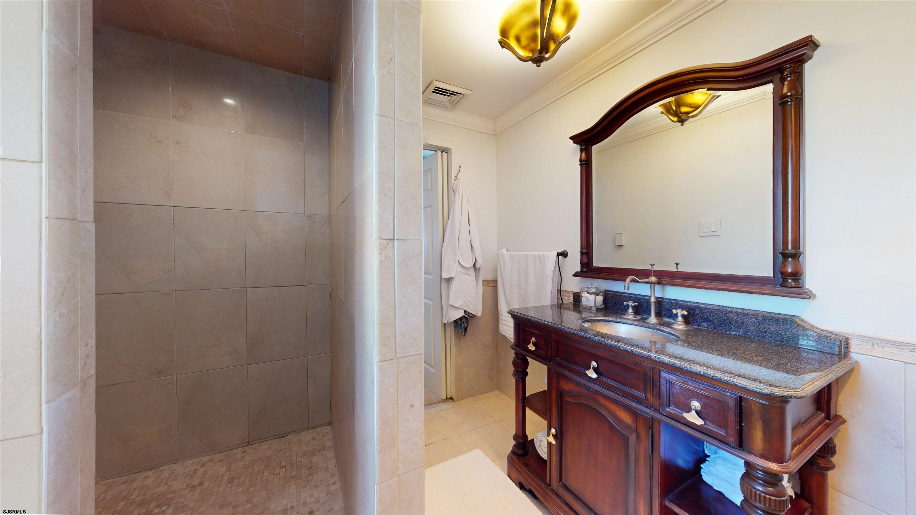 5201 Waterview Drive Brigantine, NJ 08203 - Photo 21 of 33 a bathroom with a sink and a mirror