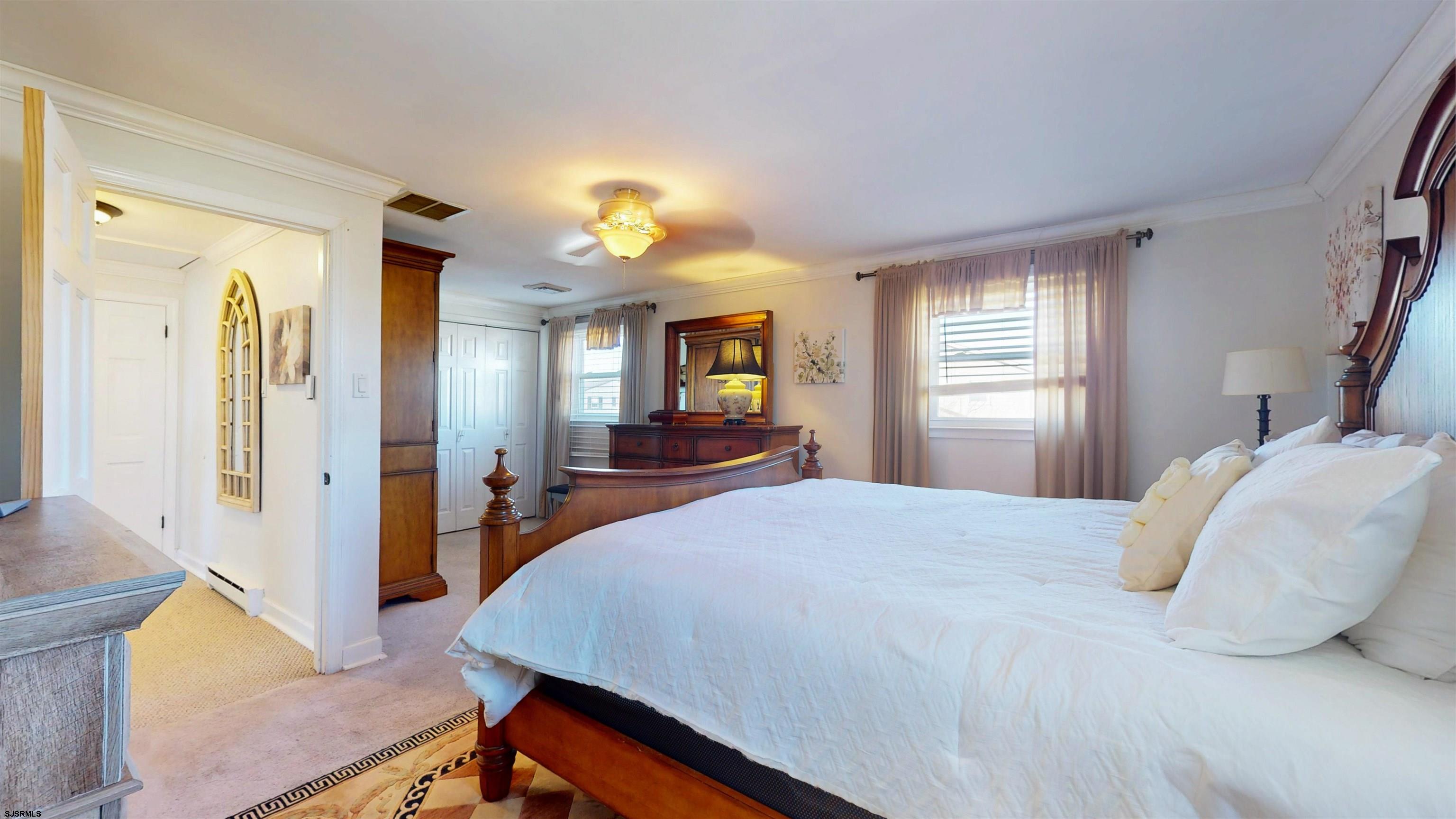 5201 Waterview Drive Brigantine, NJ 08203 - Photo 25 of 33 a bedroom with a bed and a flat screen tv