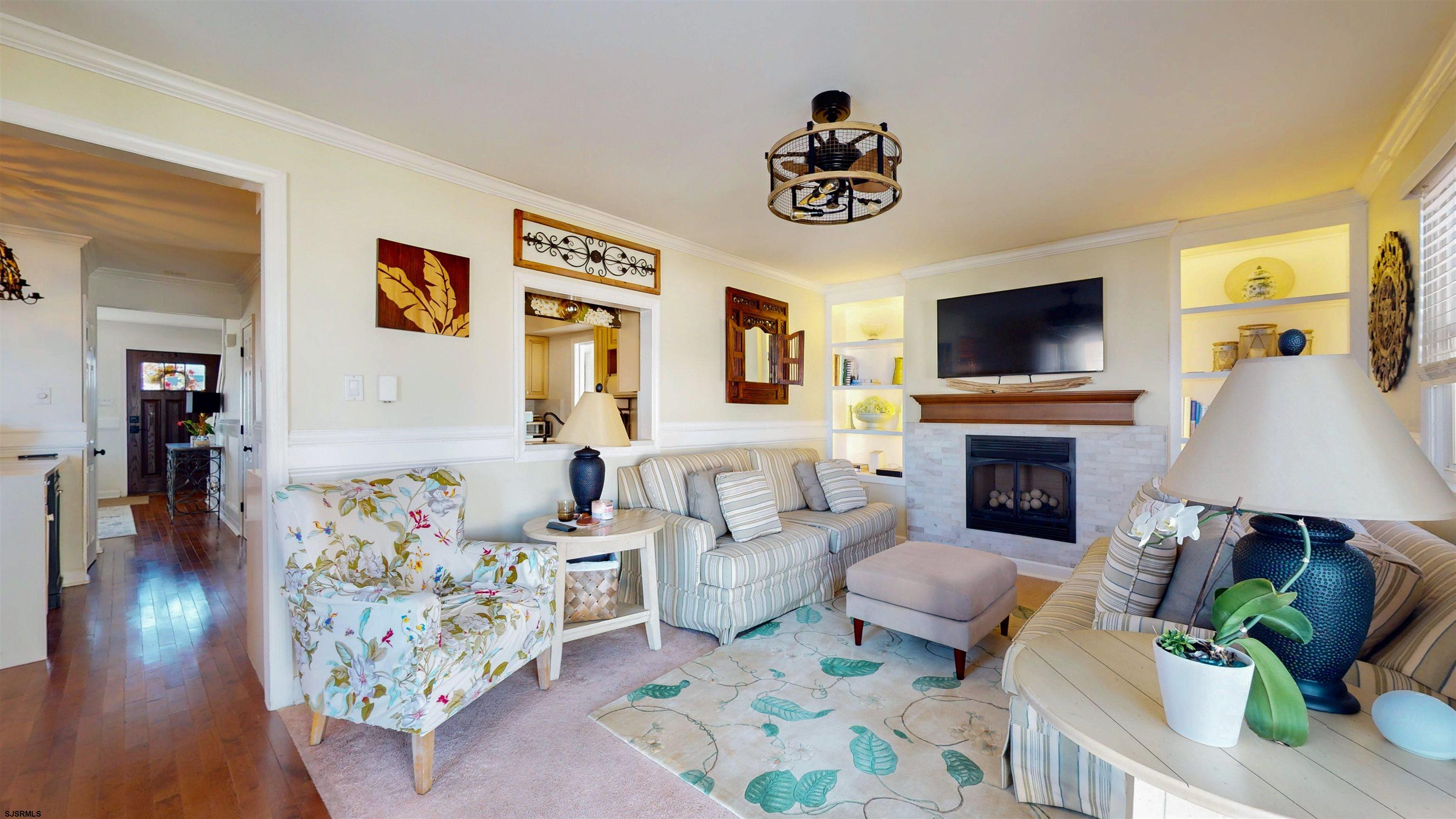 5201 Waterview Drive Brigantine, NJ 08203 - Photo 27 of 33 a living room with furniture and a flat screen tv