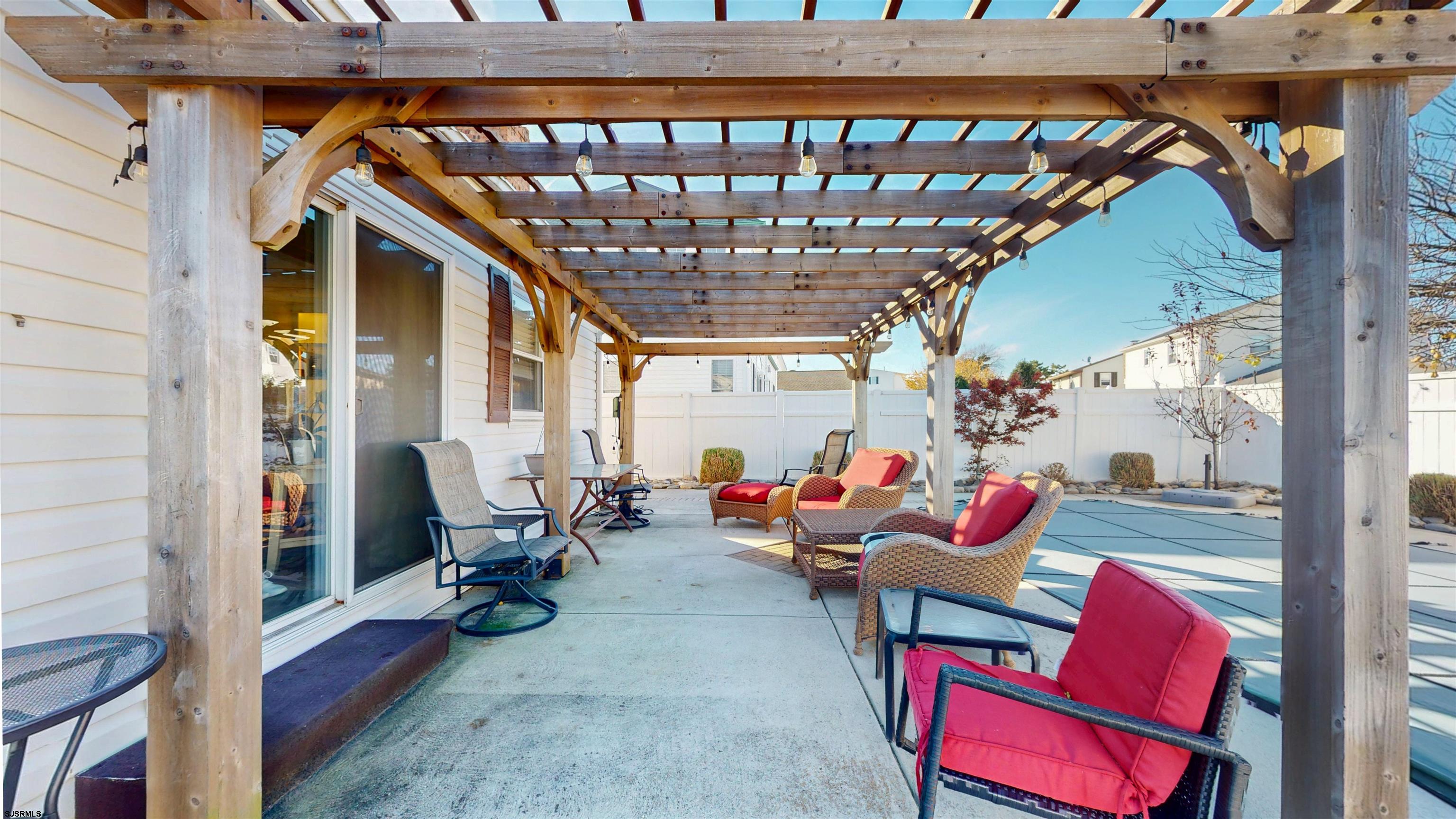 5201 Waterview Drive Brigantine, NJ 08203 - Photo 9 of 33 a outdoor space with patio furniture and a fireplace
