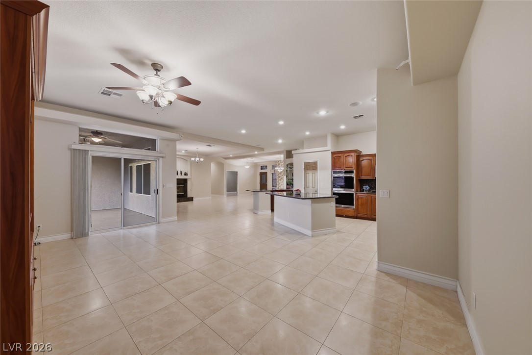 1104 Norellat Road Henderson, NV 89011 - Photo 21 of 52 Tiled floors flow through this open layout connecting the main living spaces seamlessly.