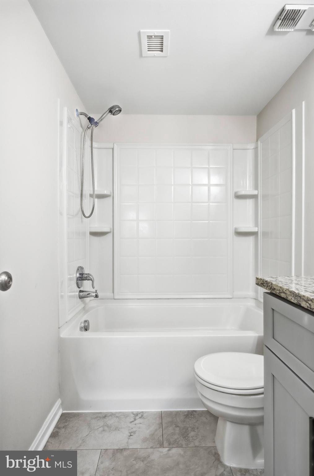 5902 Cove Landing Road, Unit 202 Burke, VA 22015 - Photo 14 of 52 a bathroom with a toilet and a bathtub