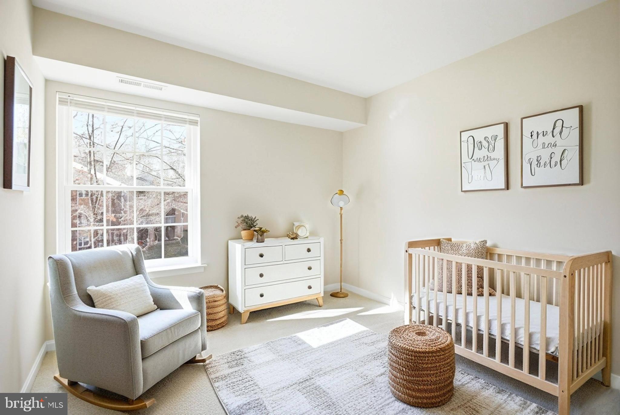 5902 Cove Landing Road, Unit 202 Burke, VA 22015 - Photo 15 of 52 a living room with furniture a baby crib and a window