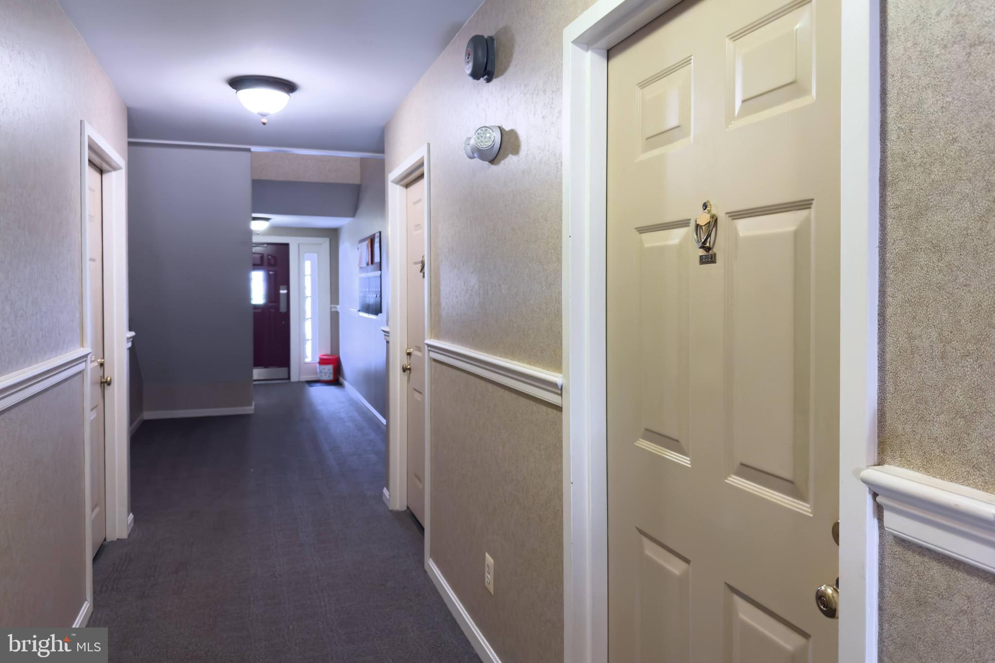 5902 Cove Landing Road, Unit 202 Burke, VA 22015 - Photo 17 of 52 a view of a hallway with wooden floor