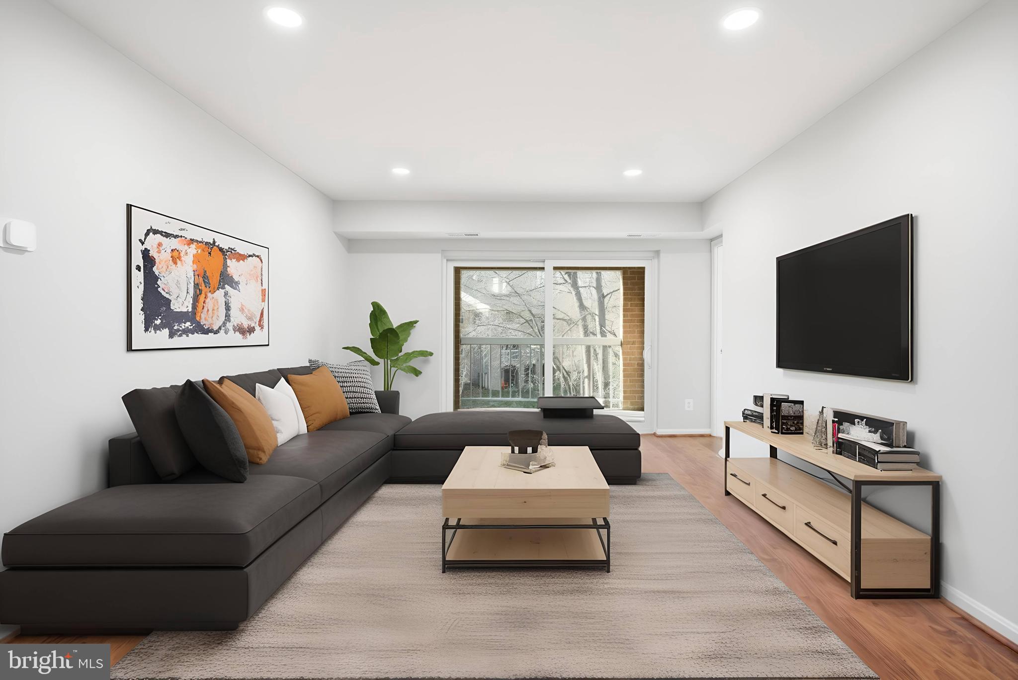 5902 Cove Landing Road, Unit 202 Burke, VA 22015 - Photo 2 of 52 a living room with furniture and a flat screen tv