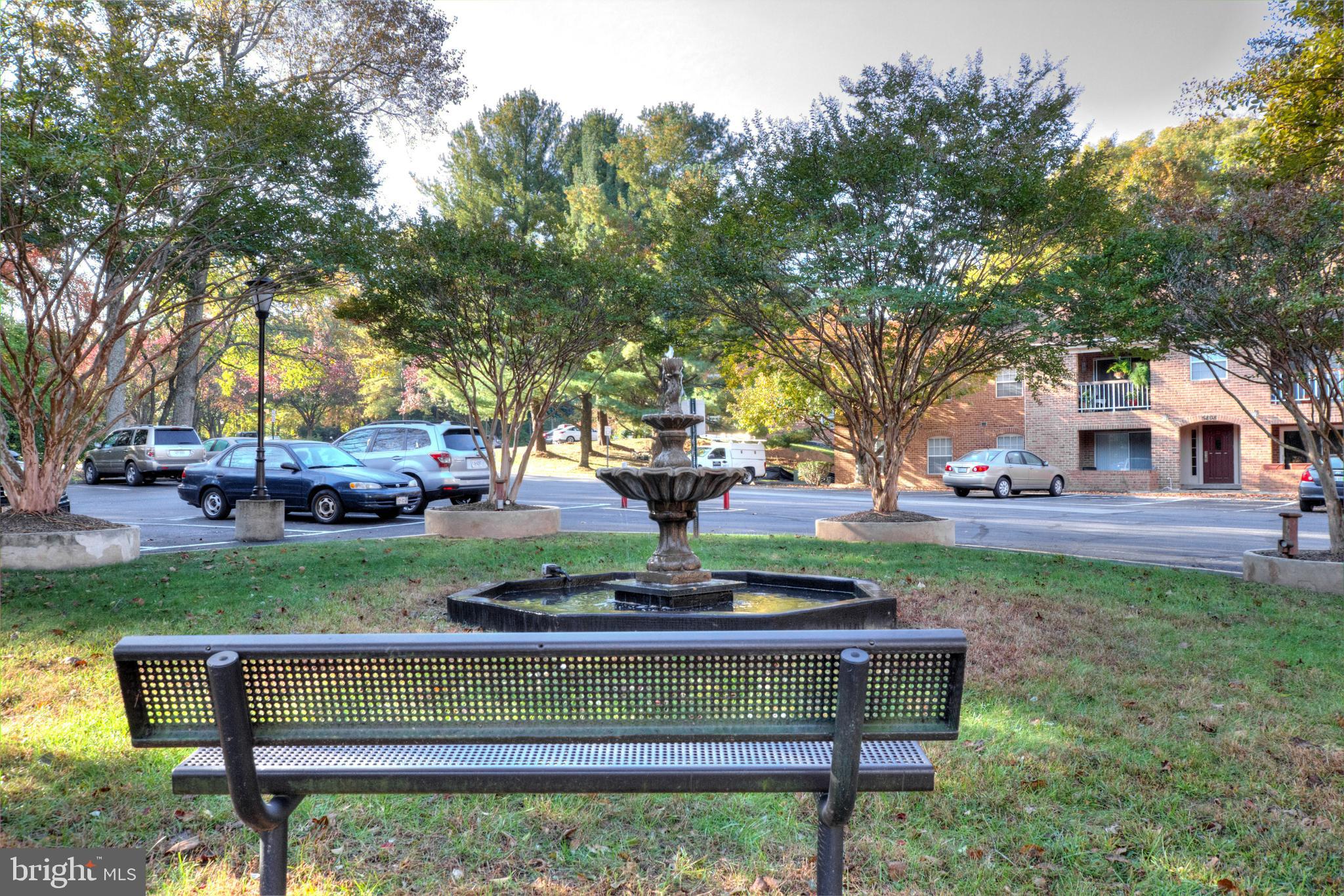 5902 Cove Landing Road, Unit 202 Burke, VA 22015 - Photo 42 of 52 a view of a bench in the garden