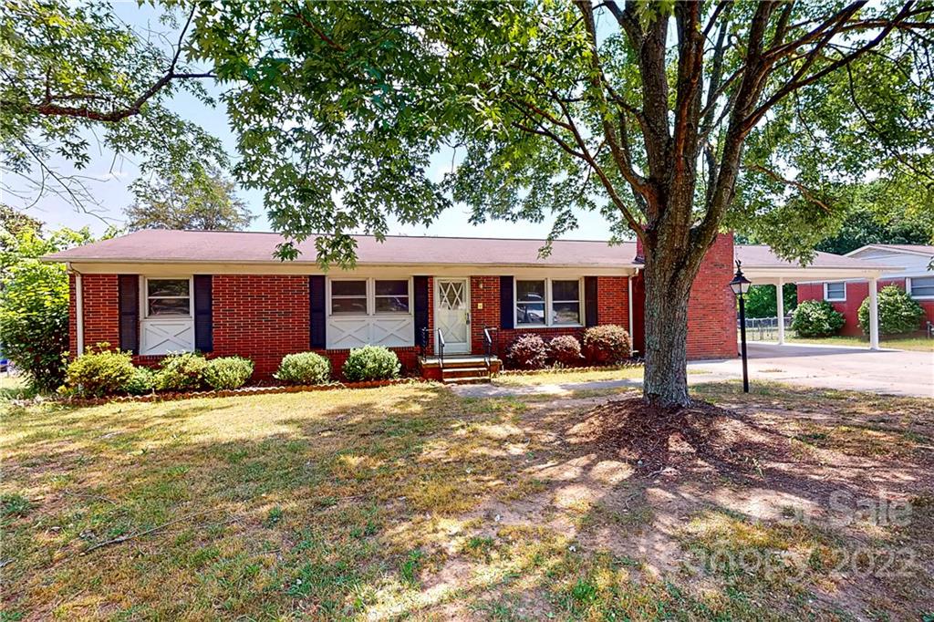 6334 Miller Road Kannapolis, NC 28081 - Photo 1 of 35 a front view of a house with a yard and trees