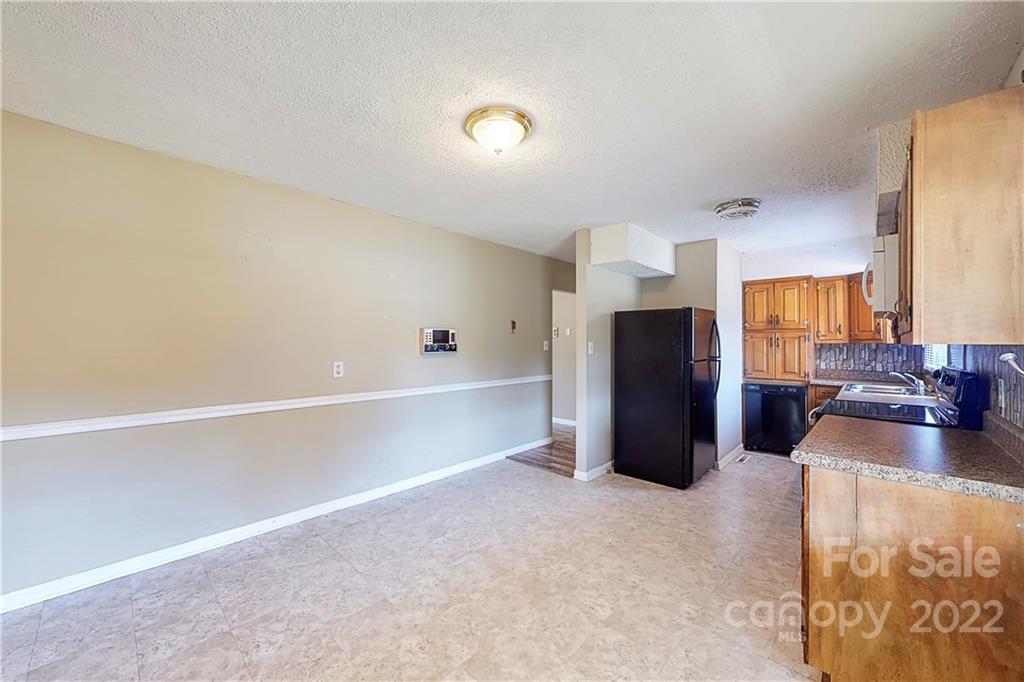 6334 Miller Road Kannapolis, NC 28081 - Photo 8 of 35 a view of a living room with furniture and a ceiling fan