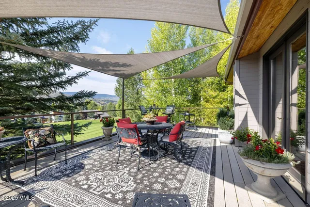 a view of a two chairs in the patio