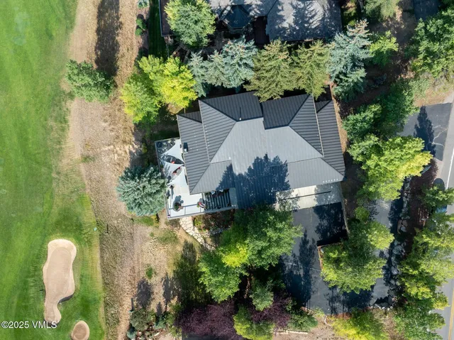 a view of a garden with a house