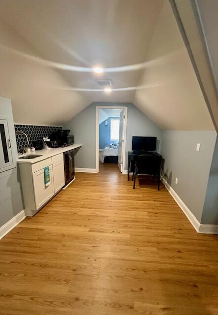 100 Broad Street, Unit E Stroudsburg, PA 18360 - Photo 12 of 25 a view of kitchen and empty room with wooden floor