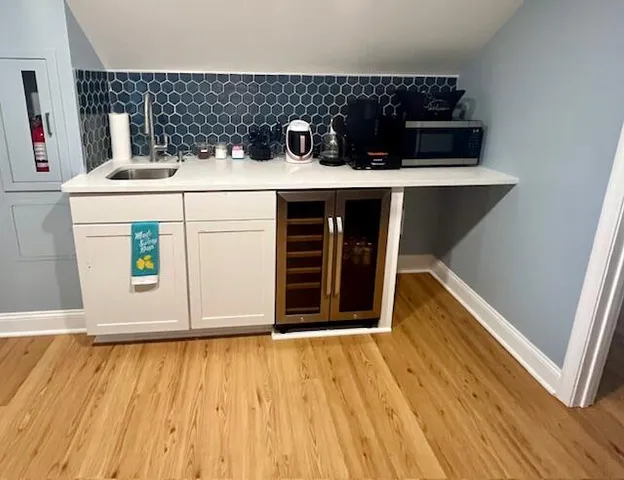 a kitchen with a refrigerator and a stove