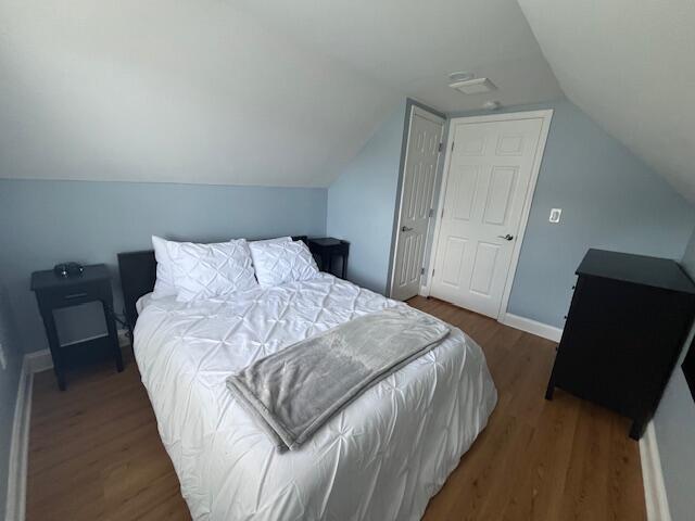 100 Broad Street, Unit E Stroudsburg, PA 18360 - Photo 15 of 25 a bedroom with a bed and a chair