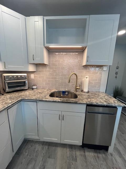 100 Broad Street, Unit E Stroudsburg, PA 18360 - Photo 4 of 25 a kitchen with stainless steel appliances granite countertop a sink stove and cabinets